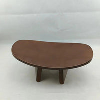 Solid wood kneeling meditation bench shown from a side angle