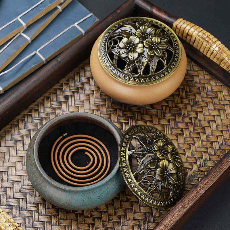 Ceramic Buddha Incense Burner with antique copper lid and smoke, perfect for meditation and calming spaces.
