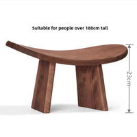 Solid wood kneeling meditation bench shown in a styled room setting