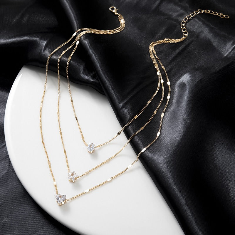 Layered Pendant Necklace Set in gold with crystal heart and star charms