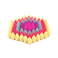 Assorted multicolor backflow incense cones arranged in a pyramid display