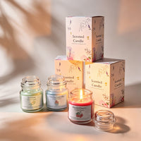 Hand holding the aromatherapy scented candle gift set by its rope handle