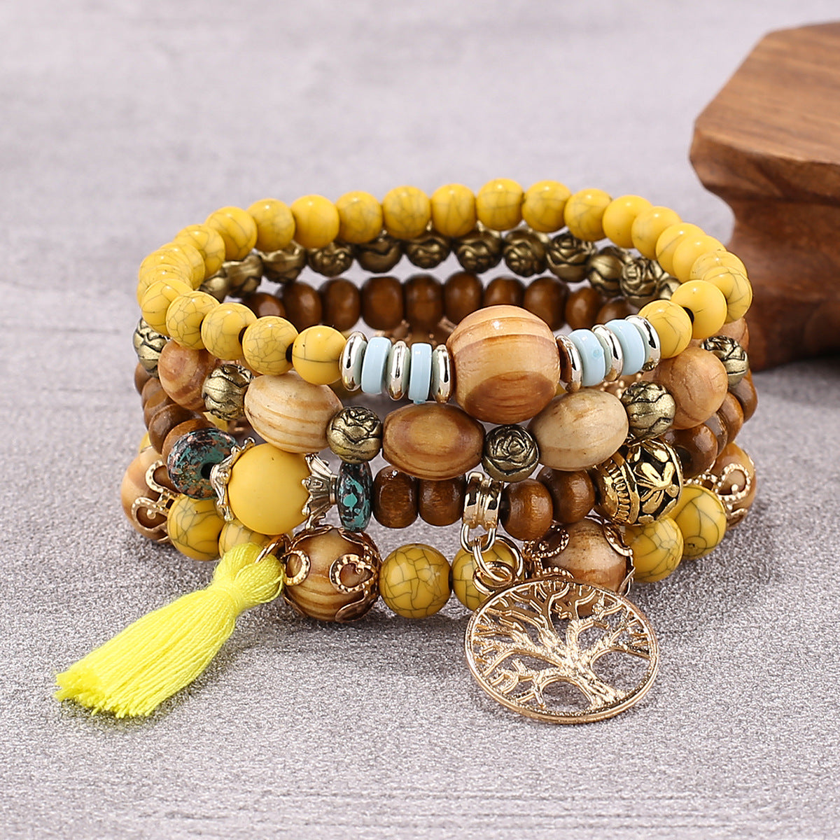 Wooden Beaded Bracelet Yellow multilayer bracelet with wooden beads and charm