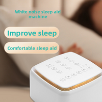White noise sleep aid machine with touch control buttons on a nightstand