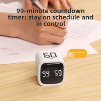 Hand flipping the digital gravity sensor timer to start a countdown