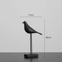 Modern minimalist bird figurine shown with dimensions for size reference